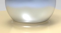 Adhesion of a sphere to a soft solid